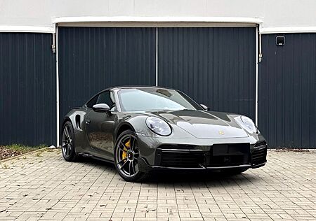 Porsche 992 Sportpaket Aventuringrün Garantie 12/28