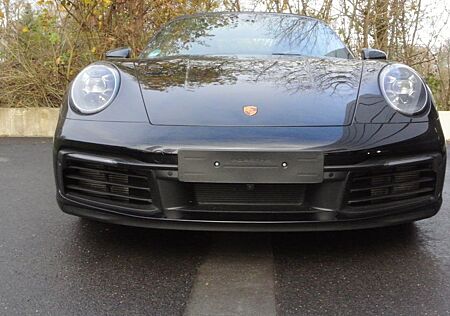 Porsche 992 cabrio,schw/schw,abgas,21",bose,matrix,kamer