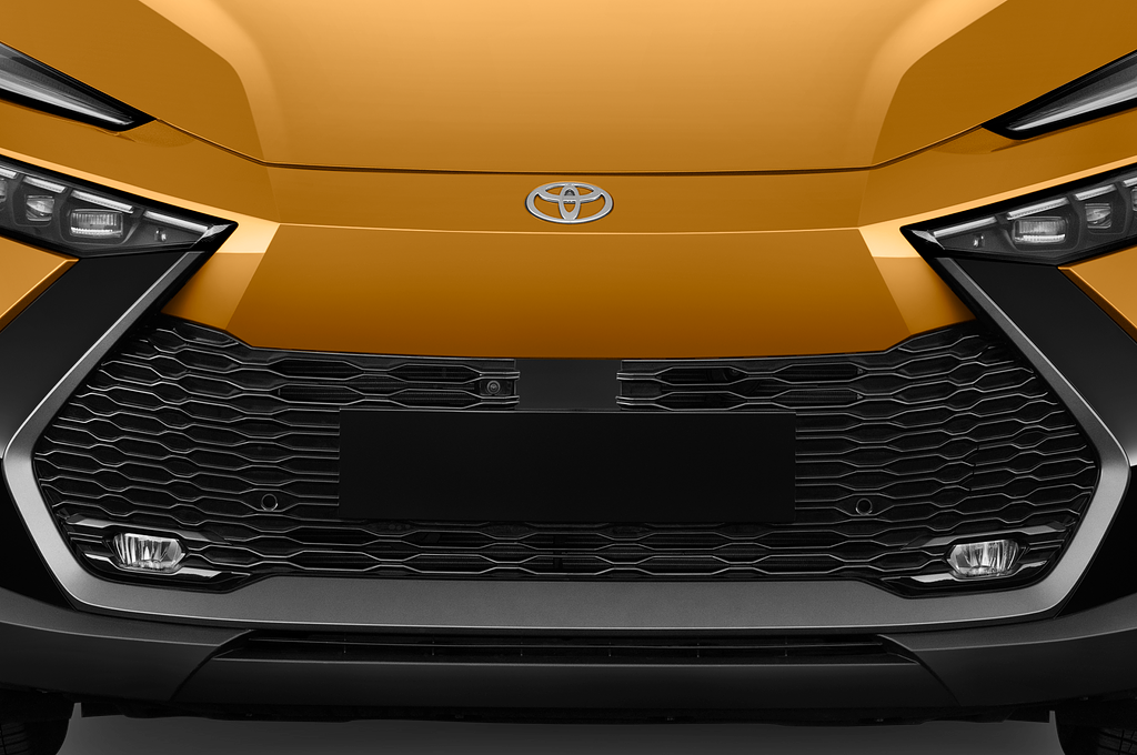 Toyota C-HR Hybrid (Baujahr 2024) Lounge Premiere 5 Türen Kühlergrill und Scheinwerfer