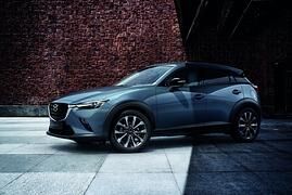 Mazda CX-3 Homura   - Grau mit bunten Sitzen  